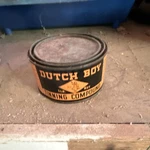 Dutch Boy Finishing Compound Can Black Orange Paint & Varnish Theme Used. Price: $22.00.